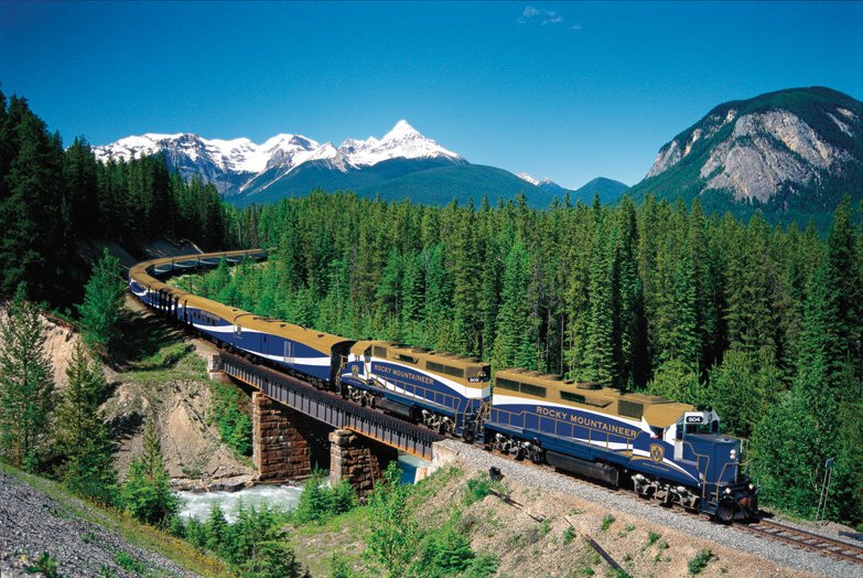 The Rocky Mountaineer train winding through the Canadian Rockies